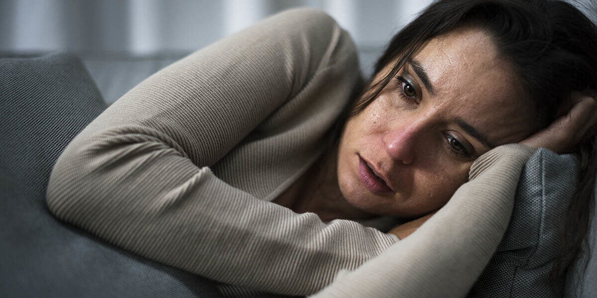 Woman experiencing heroin withdrawal symptoms